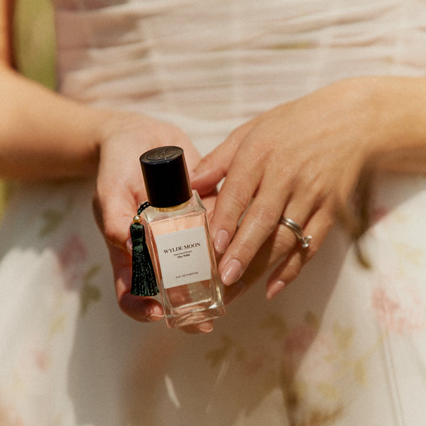 Holly Willoughby holding a bottle of her signature perfume