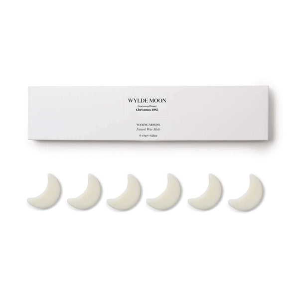 Packshot of Christmas scented wax melts with six waxing moon shapes